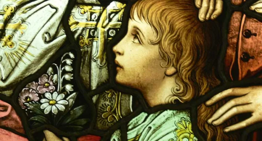 Stained glass window detail of little child
